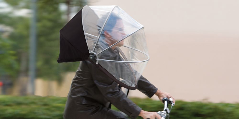 Casco con capota tipo paraguas para bicicleta